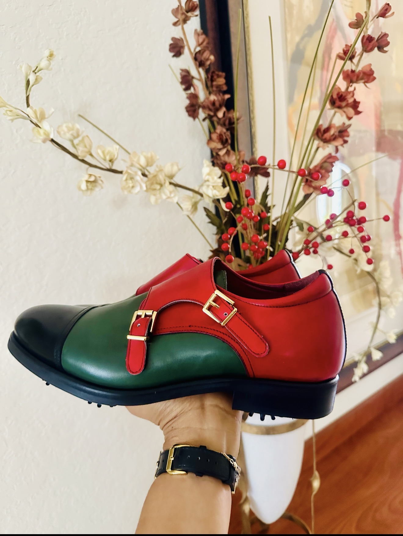 Red and green double monk strap golf shoe with gold buckles