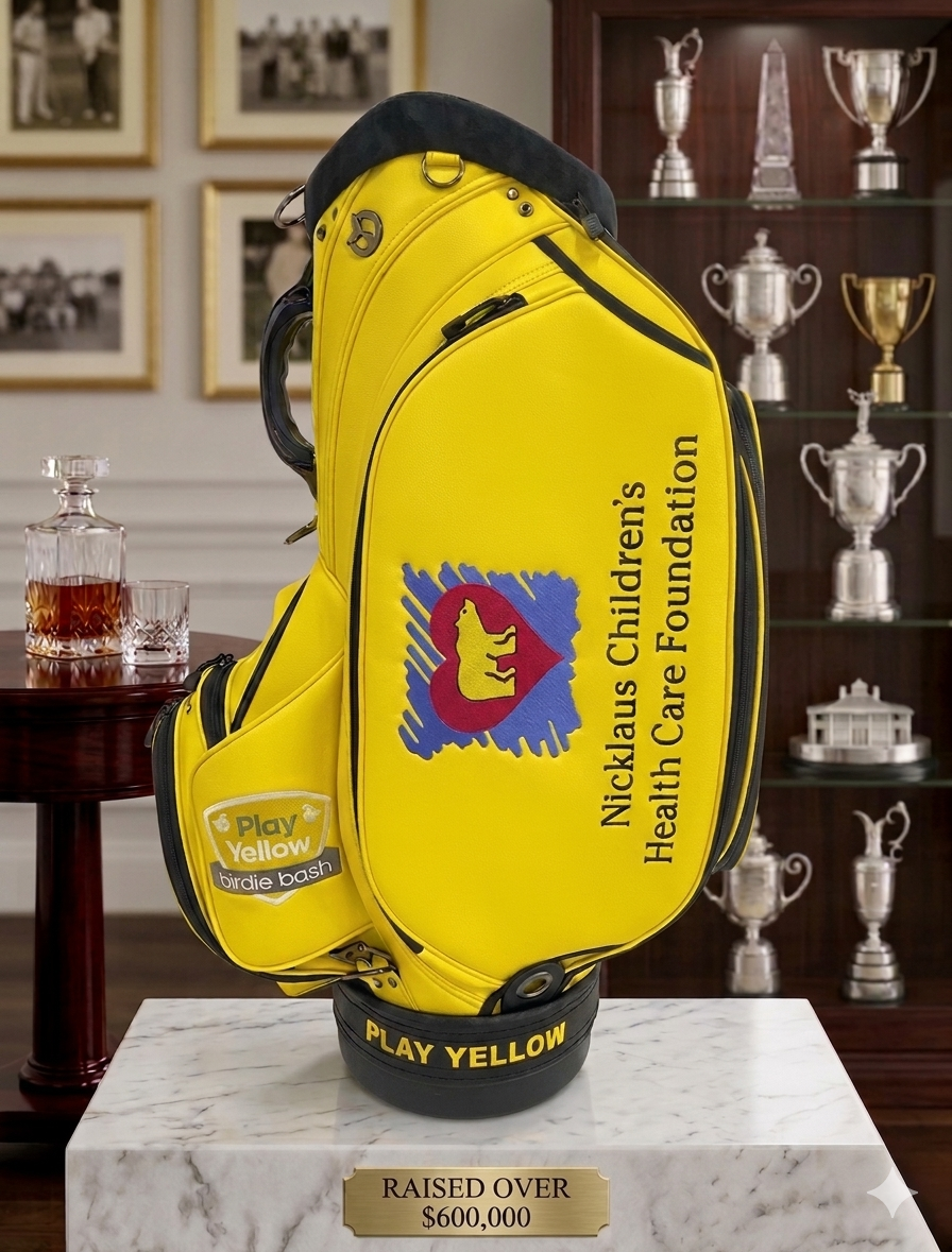The Nicklaus Commission — yellow Play Yellow staff bag for the Nicklaus Children’s Health Care Foundation with embroidered crest